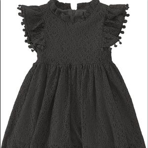Black lace dress with pom poms